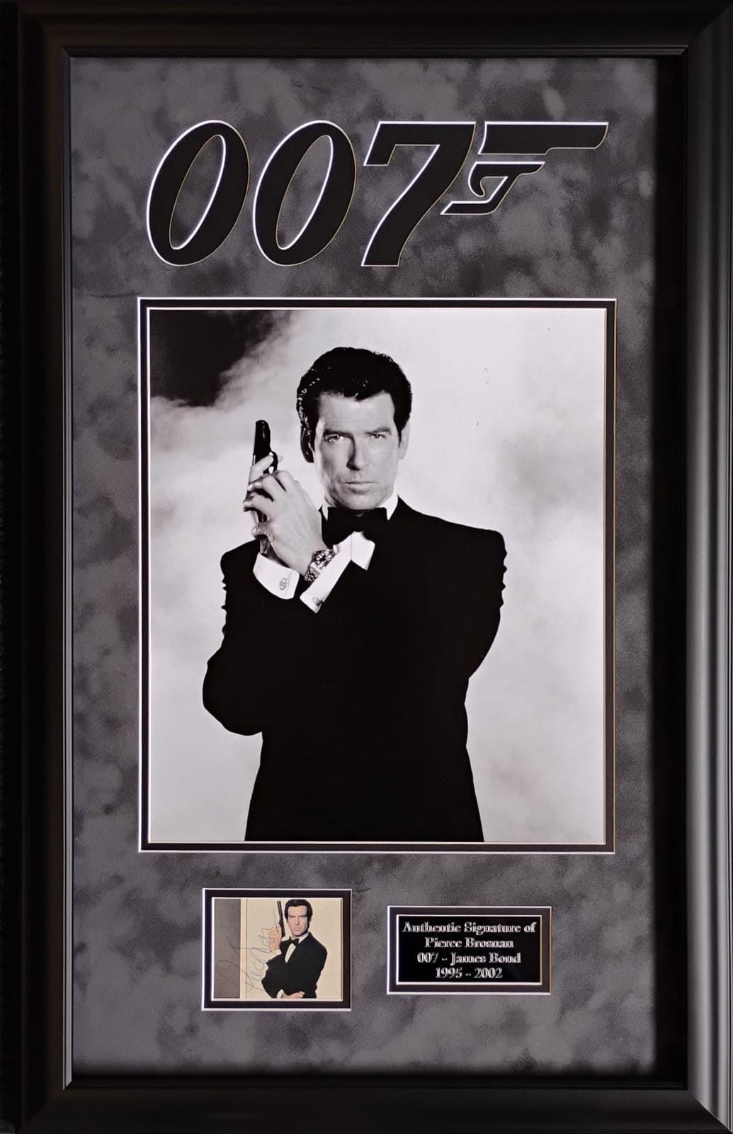 2 Signed 007's George Lazenby & Pierce Brosnan